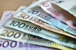 Informacija dėl euro prekybininkams, naudojantiems UAB „ASHBURN International“ mokėjimo kortelių skaitytuvus